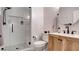 Modern bathroom with a glass-enclosed shower and wood vanity at 1513 Ravanusa Dr, Henderson, NV 89052