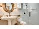 Elegant bathroom featuring walk-in shower and pedestal sink with designer fixtures at 1513 Ravanusa Dr, Henderson, NV 89052