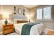 Well-decorated bedroom with a comfortable bed, bedside tables, and natural light at 1513 Ravanusa Dr, Henderson, NV 89052