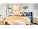 Stylish bedroom with vanity area, decorative wall hangings, and unique furnishings at 1513 Ravanusa Dr, Henderson, NV 89052