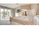 This is a view of the main bedroom featuring neutral colors, carpet floors and access to bathroom and outdoor balcony at 1513 Ravanusa Dr, Henderson, NV 89052