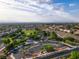 A wide view of a neighborhood with a vast playground and surrounding residential area at 1513 Ravanusa Dr, Henderson, NV 89052