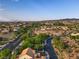 Scenic aerial view of a residential area with beautiful landscaping and winding roads at 1513 Ravanusa Dr, Henderson, NV 89052