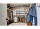 Walk-in closet featuring a custom closet system with shelves, hanging rods, drawers and baskets at 1513 Ravanusa Dr, Henderson, NV 89052