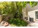 Backyard featuring mature shade tree and lush lawn at 1813 Francisco Peak Pl, Las Vegas, NV 89128