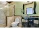 Bathroom features a glass enclosed shower, stone counters, and unique glass vessel sink at 1813 Francisco Peak Pl, Las Vegas, NV 89128