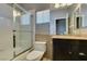 Bright bathroom featuring a tiled shower/tub and modern vanity at 1813 Francisco Peak Pl, Las Vegas, NV 89128