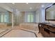 Luxurious primary bathroom with soaking tub, walk-in shower, and dual vanities at 1813 Francisco Peak Pl, Las Vegas, NV 89128