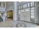 Spacious foyer with marble flooring, high ceilings, and double doors creating a luxurious entrance at 1813 Francisco Peak Pl, Las Vegas, NV 89128