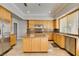 Kitchen with custom cabinets, an island, granite countertops, and stainless steel appliances at 1813 Francisco Peak Pl, Las Vegas, NV 89128