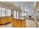 Bright kitchen with light wood cabinets, granite countertops, and stainless steel appliances at 1813 Francisco Peak Pl, Las Vegas, NV 89128