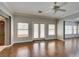 Bright living room with hardwood floors, neutral paint, and access to the backyard at 1813 Francisco Peak Pl, Las Vegas, NV 89128