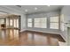 Bright living room with hardwood floors, neutral paint, and access to the backyard at 1813 Francisco Peak Pl, Las Vegas, NV 89128