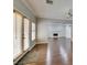 Bright living room with hardwood floors, neutral paint, and view of fireplace at 1813 Francisco Peak Pl, Las Vegas, NV 89128