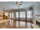 Living room with hardwood floors, fireplace, and open access to the kitchen and back yard at 1813 Francisco Peak Pl, Las Vegas, NV 89128