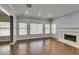 Spacious living room with hardwood floors, fireplace, and lots of natural light at 1813 Francisco Peak Pl, Las Vegas, NV 89128