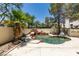 Backyard pool with rock waterfall feature and mature trees at 1813 Francisco Peak Pl, Las Vegas, NV 89128