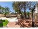 Backyard pool with brick patio and shade trees at 1813 Francisco Peak Pl, Las Vegas, NV 89128