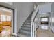 Modern staircase with wood treads and white railing, leading to the upper level of the home at 1813 Francisco Peak Pl, Las Vegas, NV 89128
