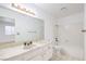 Bright bathroom with a tub and a marble vanity at 1857 Arbol Verde Way, Las Vegas, NV 89119