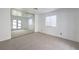 Bedroom features a large mirrored closet and access to the outside at 1857 Arbol Verde Way, Las Vegas, NV 89119