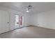 Cozy bedroom featuring neutral carpet, a ceiling fan, closet, and access to the backyard at 1857 Arbol Verde Way, Las Vegas, NV 89119