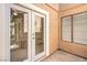 Exterior shot of a window and glass doors overlooking a patio at 1857 Arbol Verde Way, Las Vegas, NV 89119