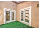 Enclosed patio showing artificial turf and double doors at 1857 Arbol Verde Way, Las Vegas, NV 89119