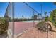 Fenced tennis court, set amidst mature landscaping, providing a private and enjoyable playing experience at 1857 Arbol Verde Way, Las Vegas, NV 89119