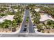 Gated community entrance featuring mature palm trees and well-maintained landscaping at 2209 Purple Majesty Ct, Las Vegas, NV 89117
