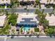 Birds eye view of the home with a sparkling blue pool and solar panels on the roof at 2209 Purple Majesty Ct, Las Vegas, NV 89117