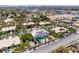 Wide neighborhood view with a home that has a large backyard pool and solar panels on the roof at 2209 Purple Majesty Ct, Las Vegas, NV 89117