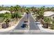 View of an upscale community entrance with attractive landscaping, street signs, and ornate gates at 2209 Purple Majesty Ct, Las Vegas, NV 89117