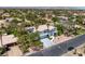 Front view of a two-story house with a three-car garage and palm tree landscaping at 2209 Purple Majesty Ct, Las Vegas, NV 89117