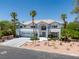 Beautiful two-story home featuring a three-car garage, tile roof, and palm tree landscaping at 2209 Purple Majesty Ct, Las Vegas, NV 89117