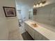 Bathroom with vanity with large mirror and decorative light fixture at 3110 National Ave, Pahrump, NV 89048