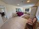 Bright sunroom with tile floors, comfortable seating, and natural light at 3110 National Ave, Pahrump, NV 89048