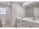 Bathroom features a dual sink vanity and a separate toilet and shower area at 3164 Bormida Ave, Henderson, NV 89044