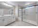 Bathroom features double sink vanity, a large glass shower, and elegant tile flooring at 3164 Bormida Ave, Henderson, NV 89044