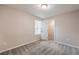 Neutral bedroom features carpet flooring, light-filled windows, and closet access at 3164 Bormida Ave, Henderson, NV 89044