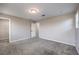 Bedroom with neutral walls and carpets featuring an en-suite bathroom and walk-in closet at 3164 Bormida Ave, Henderson, NV 89044