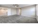 Expansive bedroom showcasing neutral walls, plush carpeting, and stylish ceiling fan at 3164 Bormida Ave, Henderson, NV 89044