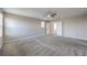 Spacious bedroom featuring neutral walls, soft carpeting, and a modern ceiling fan at 3164 Bormida Ave, Henderson, NV 89044