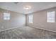 Bright bedroom featuring carpeting and multiple windows for ample natural light at 3164 Bormida Ave, Henderson, NV 89044