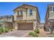 Charming two-story home with a paver driveway, a two-car garage, and desert landscaping at 3164 Bormida Ave, Henderson, NV 89044