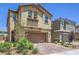 Charming two-story home with a paver driveway, a two-car garage, and desert landscaping at 3164 Bormida Ave, Henderson, NV 89044
