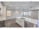 Open floor plan with a spacious living room and a kitchen with an island at 3164 Bormida Ave, Henderson, NV 89044