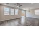 Spacious living room featuring lots of natural light, recessed lighting, and wood floors at 3164 Bormida Ave, Henderson, NV 89044