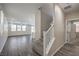 Hallway view of an open concept living area with hardwood floors and a kitchen island at 3164 Bormida Ave, Henderson, NV 89044