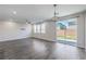 Bright and open living area with sliding glass doors, recessed lighting and modern flooring at 3164 Bormida Ave, Henderson, NV 89044